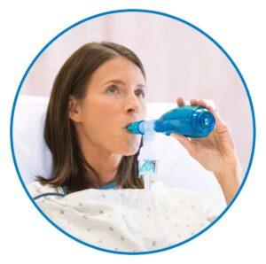 Woman using an Acapella Breathing Device in Boynton Beach, FL